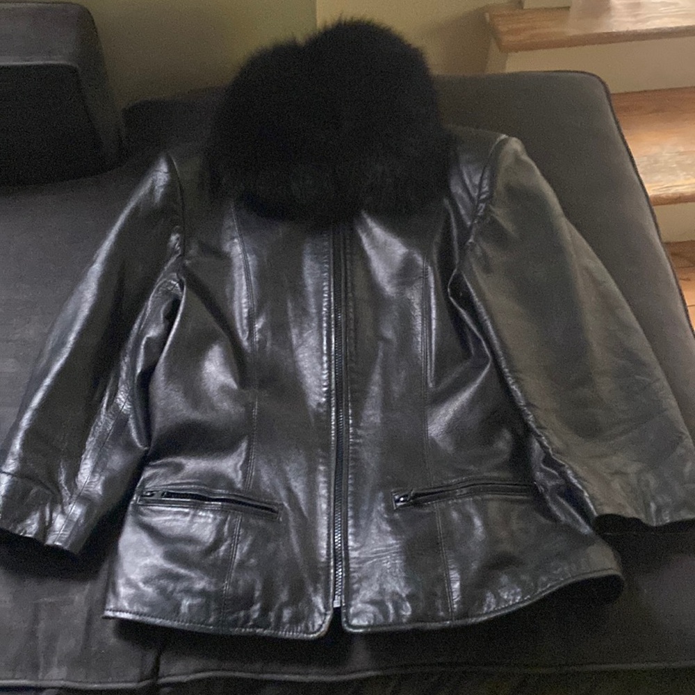 Black leather jacket with fur collar.